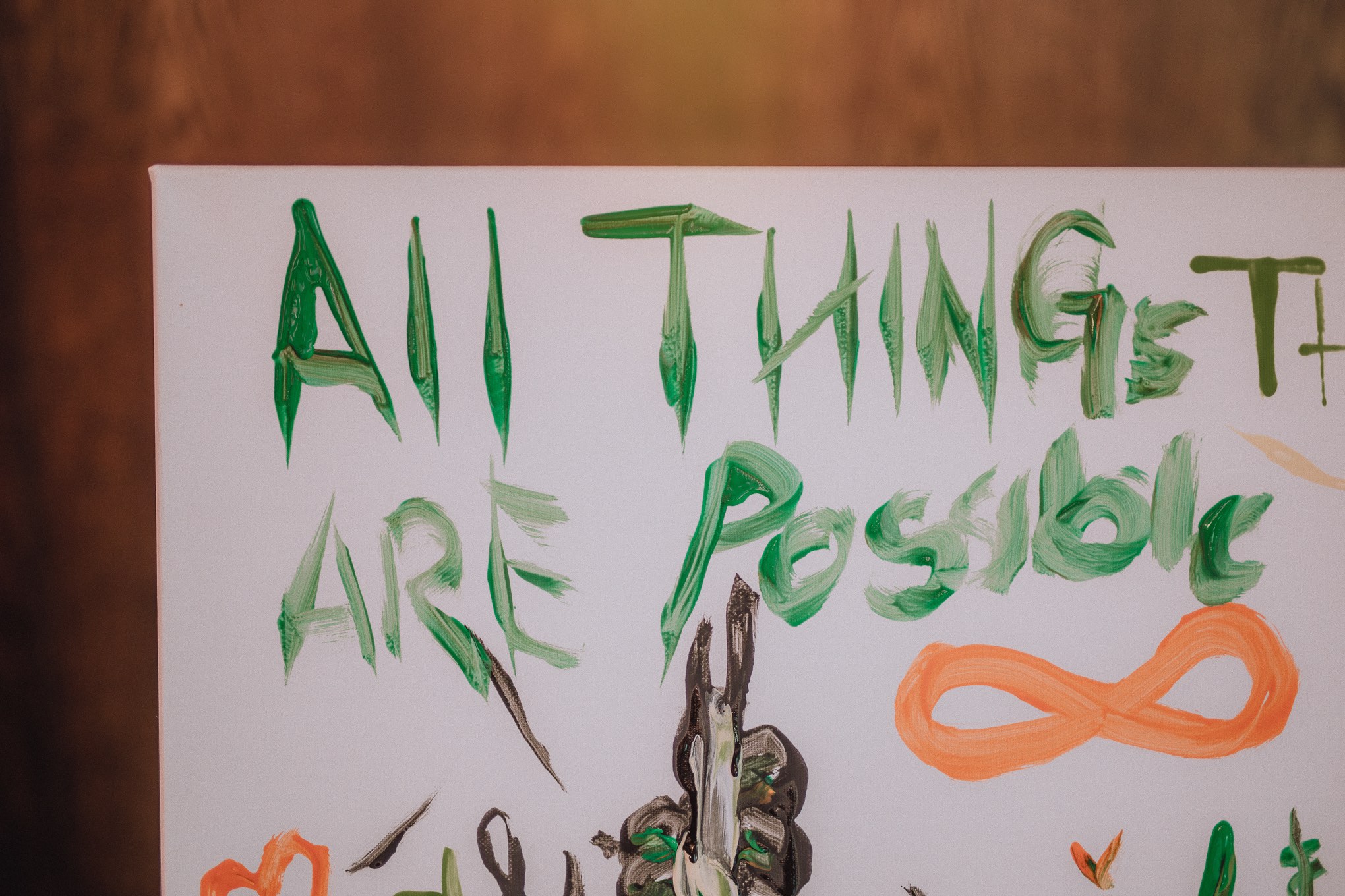 Hand-painted wedding sign reading “All Things Are Possible,” captured with soft light and creative detail during a wedding day, relax natural wedding photographer Glasgow Scotland