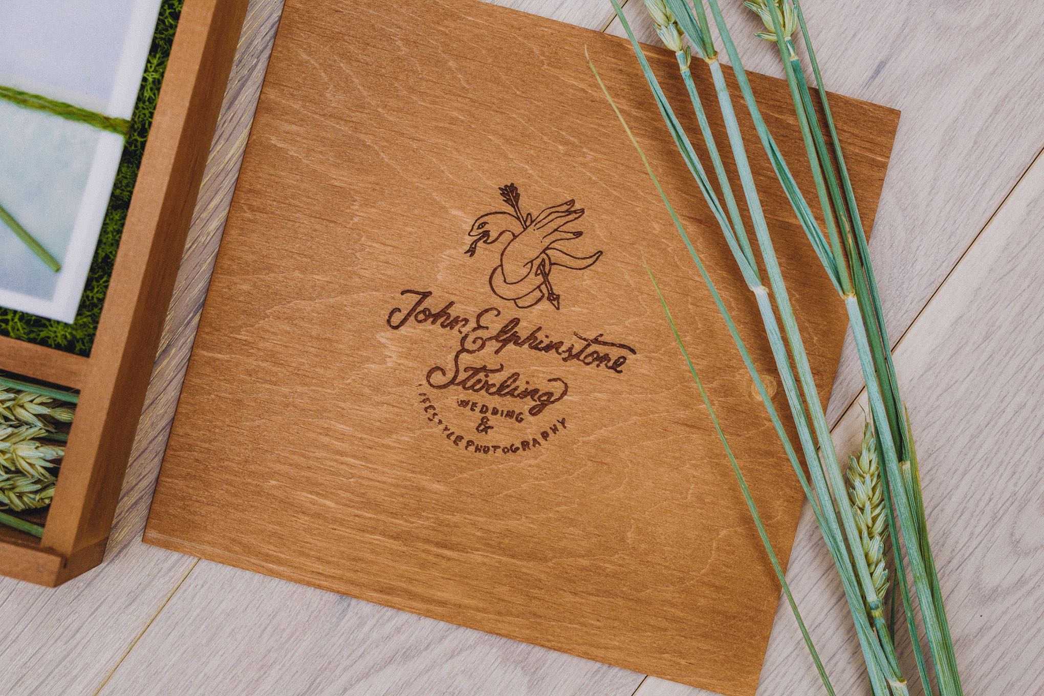 Handcrafted alderwood wedding keepsake box containing printed photographs and a USB, styled with natural twine and dried wheat, showcasing a tactile heirloom alternative to digital galleries, relax natural wedding photographer Glasgow Scotland